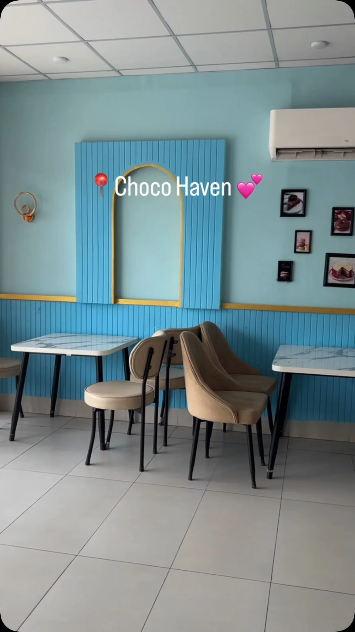 The bright blue and cream interior of Choco Haven Bake Shop